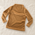The High-Neck Layering Top — Khaki, laid flat on ivory linen