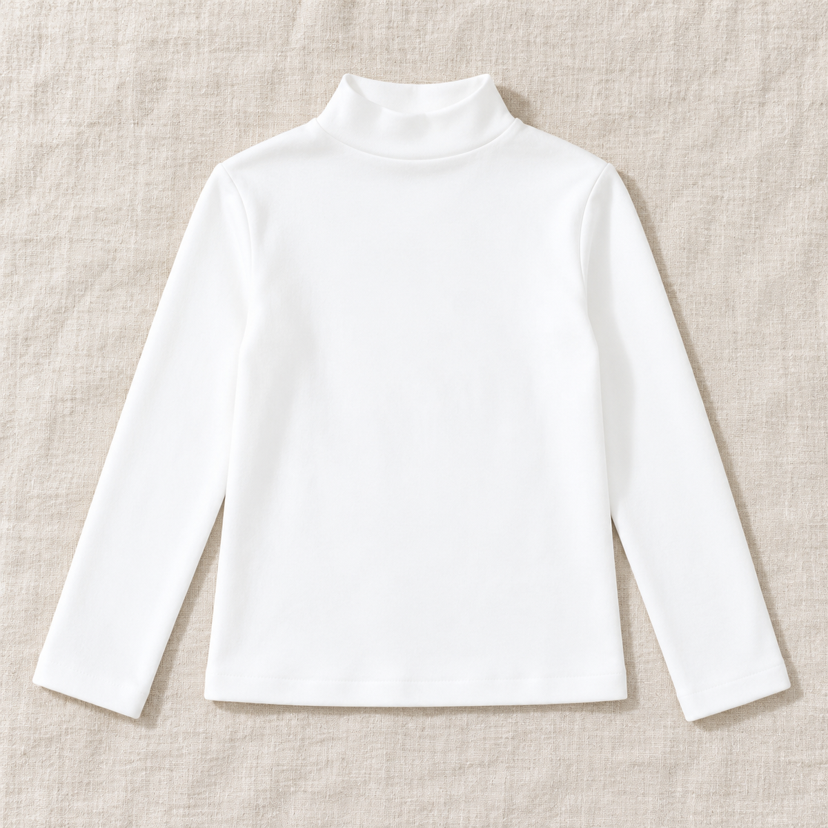 The High-Neck Layering Top — White, laid flat on ivory linen