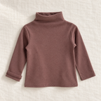 The High-Neck Layering Top — Brown, laid flat on ivory linen
