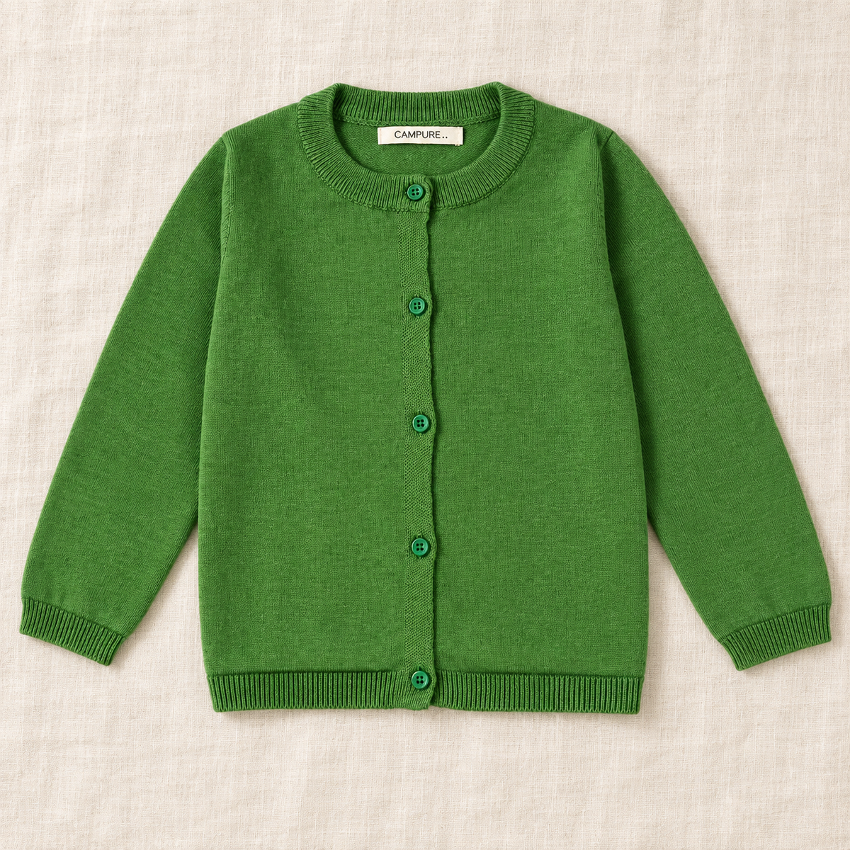 The Everyday Fine Knit Cardigan — Green, laid flat on ivory linen