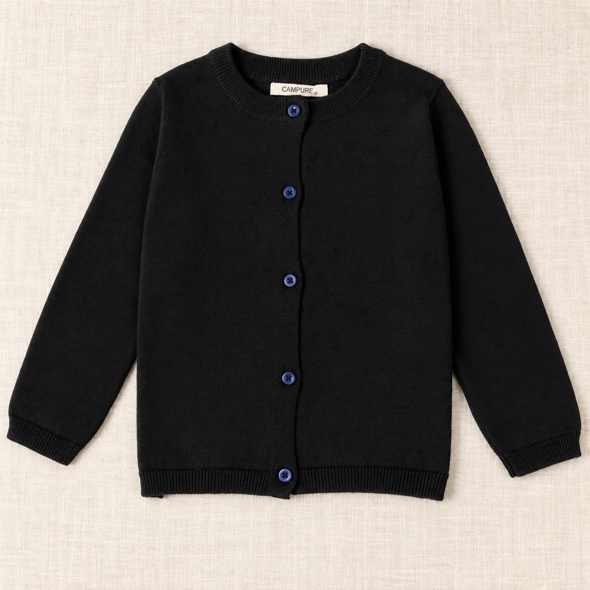 The Everyday Fine Knit Cardigan — Black, laid flat on ivory linen