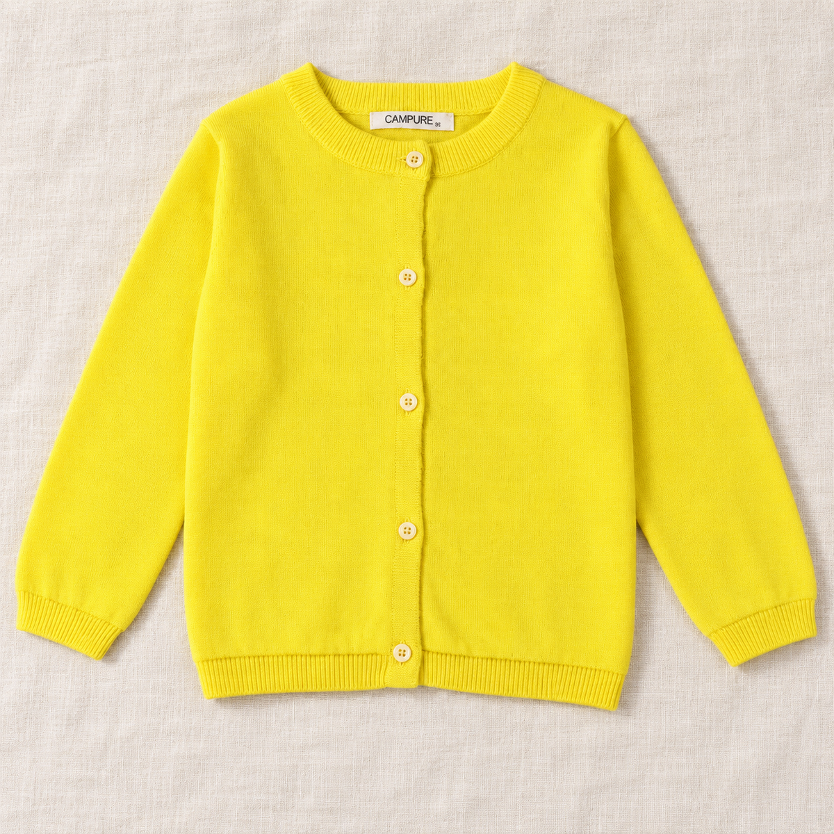 The Everyday Fine Knit Cardigan — Yellow, laid flat on ivory linen