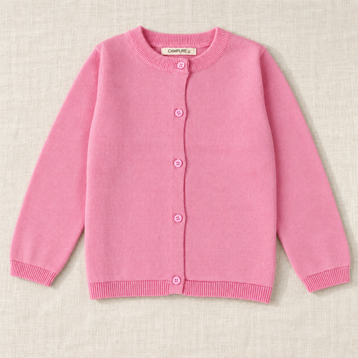 The Everyday Fine Knit Cardigan — Pink, laid flat on ivory linen