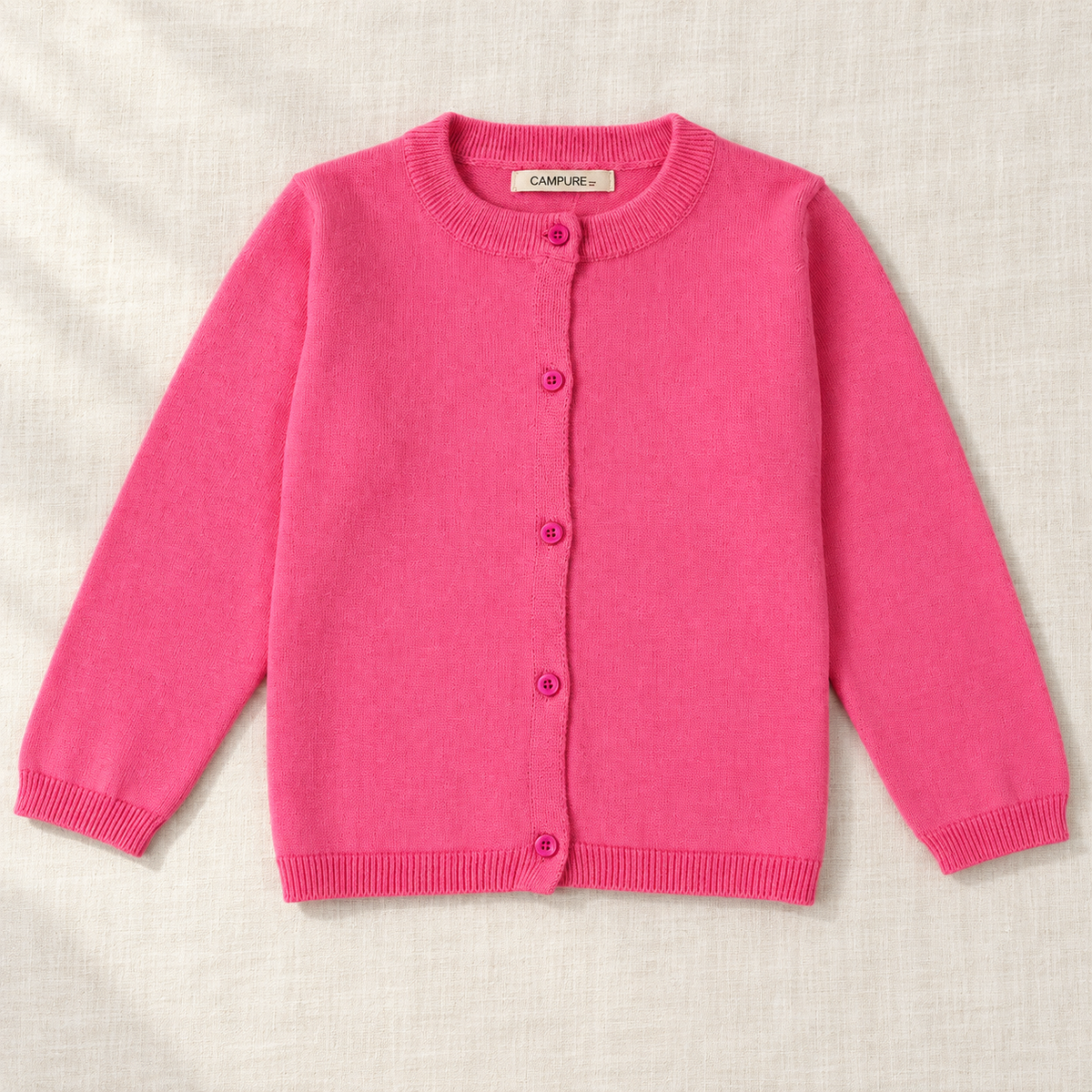 The Everyday Fine Knit Cardigan — Dusty Rose, laid flat on ivory linen