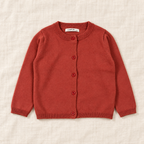 The Everyday Fine Knit Cardigan — Terracotta, laid flat on ivory linen