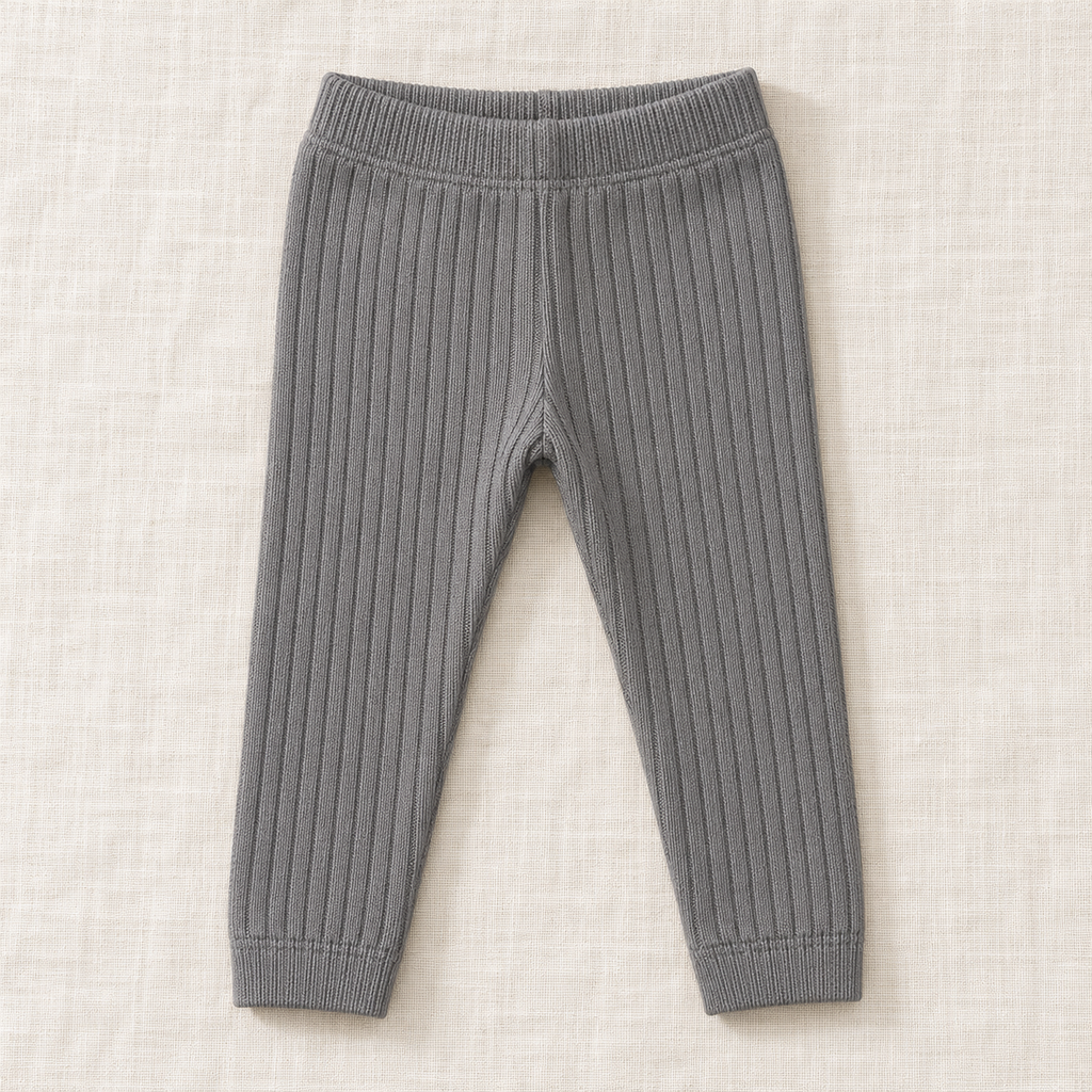 The Everyday Rib Knit Leggings — Dark Grey, laid flat on ivory linen