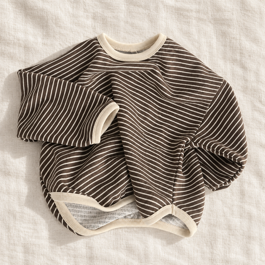 The Fine Stripe Long-Sleeve Top — Brown & Ivory Stripes, laid flat on ivory linen