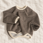 The Fine Stripe Long-Sleeve Top — Brown & Ivory Stripes, laid flat on ivory linen