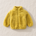 The Plush Zip Jacket — Yellow, laid flat on ivory linen