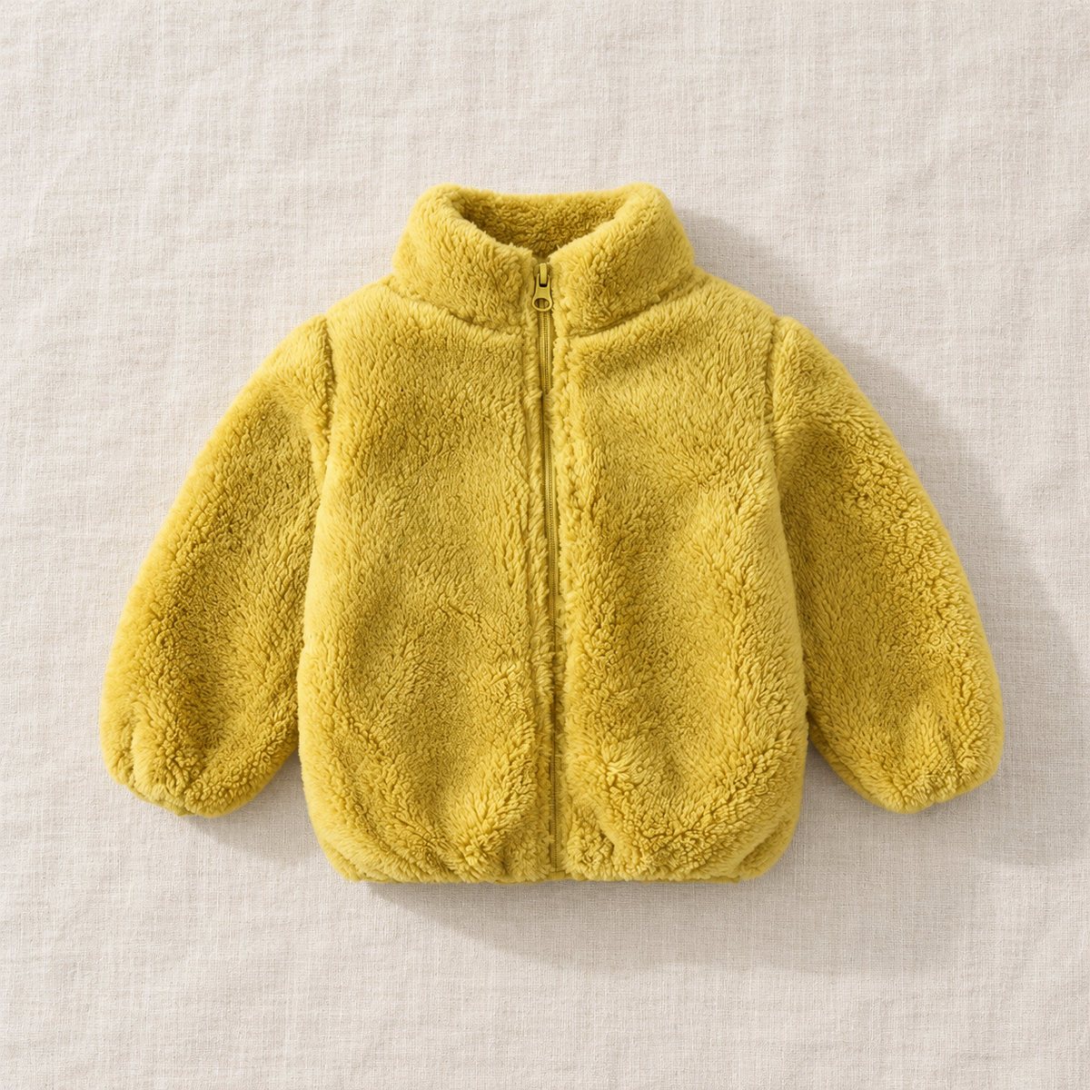 The Plush Zip Jacket — Yellow, laid flat on ivory linen