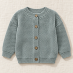 The Ribbed Button Knit Cardigan — Grey Blue, laid flat on ivory linen