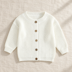 The Ribbed Button Knit Cardigan — White, laid flat on ivory linen
