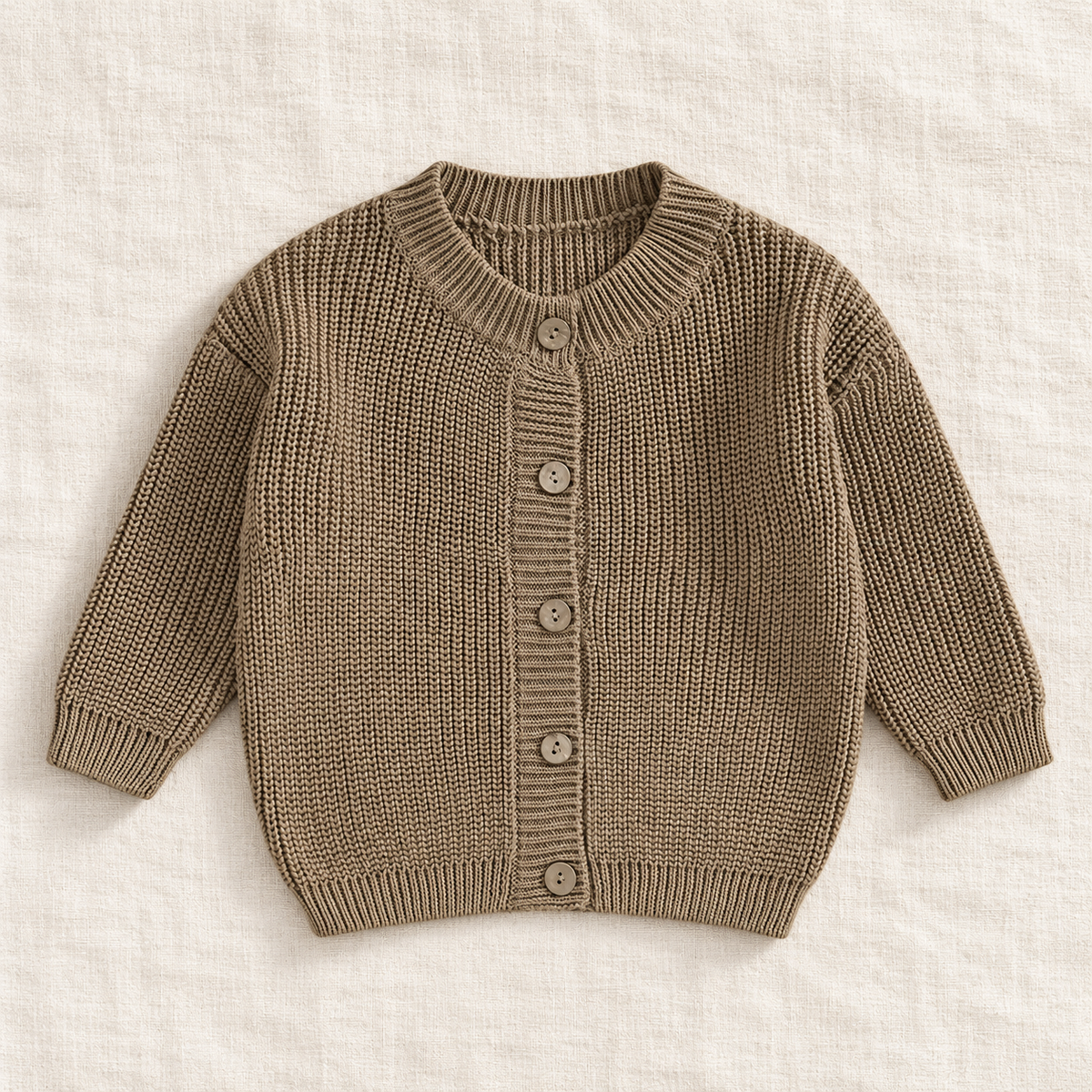 The Ribbed Button Knit Cardigan — Khaki, laid flat on ivory linen