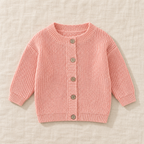 The Ribbed Button Knit Cardigan — Pink, laid flat on ivory linen