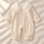 The Peter Pan Floral Baby Romper — Style 02 studio photograph