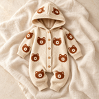 The Bear Hooded Knit Romper studio photograph on ivory linen