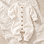 The Classic Button Knit Romper studio photograph on ivory linen