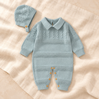 The Cotton Knit Romper & Hat Set studio photograph on ivory linen