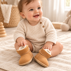Baby wearing The Cozy Velcro Baby Boots in a warm nursery