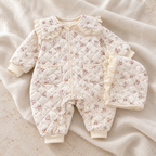 The Floral Romper & Hat Set studio photograph on ivory linen