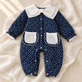 The Polka Dot Collared Baby Romper studio photograph on ivory linen