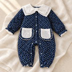 The Polka Dot Collared Baby Romper studio photograph on ivory linen