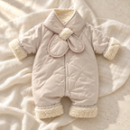 The Retro Plush Baby Romper studio photograph on ivory linen