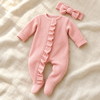The Ruffle Footed Romper & Headband studio photograph on ivory linen