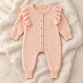 The Winter Knit Baby Romper studio photograph on ivory linen