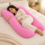Full-body pregnancy pillow — Pink — White Hearts, used by an adult woman on cream linen