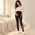 Tots & Moms maternity jeans — Black — Floral Love, worn by an adult model